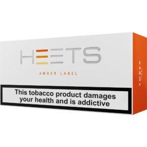 <h1>AMBER LABEL HEETS IQOS</h1> IQOS HEETS AMBER LABEL provides a rich and satisfying tobacco experience, tailored for users who enjoy a robust and full-bodied flavor profile. These sticks are meticulously crafted to be compatible with all IQOS devices, ensuring a consistent and enjoyable smoking experience. <strong>Flavor Profile:</strong> HEETS AMBER LABEL presents a bold blend of premium tobacco, delivering a robust and intense taste with deep, nutty undertones. This variant is perfect for those seeking a hearty and satisfying smoking experience with a touch of richness. <strong>YOU CAN EXPLORE MORE IQOS ILUMA HEETS <a href="https://rockstarvapor.co/product-category/iqos-heets-pakistan/" target="_blank" rel="noopener">HERE!</a></strong> <p class="selectable-text copyable-text iq0m558w g0rxnol2" dir="ltr"><span class="selectable-text copyable-text">At Rockstar, we believe every purchase is an experience of convenience, quality, and satisfaction.</span></p> <p class="selectable-text copyable-text iq0m558w g0rxnol2" dir="ltr"><span class="selectable-text copyable-text jv8stmnn">*</span><b><strong class="selectable-text copyable-text nbipi2bn">Price Match Guarantee:</strong></b><span class="selectable-text copyable-text jv8stmnn">*</span><span class="selectable-text copyable-text"> We’re committed to offering you the best value on your purchases. If you find a lower price on an identical item from a competitor, simply let us know, and we’ll beat it.</span></p> <p class="selectable-text copyable-text iq0m558w g0rxnol2" dir="ltr"><span class="selectable-text copyable-text">Shop with confidence, knowing that you’re getting the best deal possible. Enjoy the ease of browsing and purchasing from the comfort of your home, Explore our catalog, place order, and get doorstep delivery. Our knowledgeable and friendly team is here to assist you with your order to make your shopping enjoyable,</span></p> <p class="selectable-text copyable-text iq0m558w g0rxnol2" dir="ltr"><span class="selectable-text copyable-text">We are located just around the corner in <a href="https://www.google.com/maps?ll=24.797475,67.044777&z=16&t=m&hl=en&gl=US&mapclient=embed&cid=3248600491974334453" target="_blank" rel="noopener">DHA Phase 5</a> & <a href="https://www.google.com/maps/place/Rockstar+Vapor+Co+-+Clifton+(Vape+Store)/@24.8271319,67.0278464,17z/data=!4m14!1m7!3m6!1s0x3eb33d243236324b:0xaa9b07f8edc863c0!2sRockstar+Vapor+Co+-+Clifton+(Vape+Store)!8m2!3d24.8271319!4d67.0304213!16s%2Fg%2F11twsg4yj7!3m5!1s0x3eb33d243236324b:0xaa9b07f8edc863c0!8m2!3d24.8271319!4d67.0304213!16s%2Fg%2F11twsg4yj7?entry=tt" target="_blank" rel="noopener">Clifton Boat Basin</a>, any of our store is your go-to spot for the latest vape gear, trendsetting flavors, and a vibe that’s as chill as it gets.</span></p> AMBER LABEL HEETS IQOS
